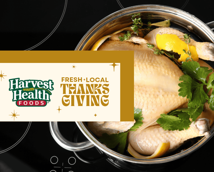 Image of an uncooked turkey in a pot with herbs